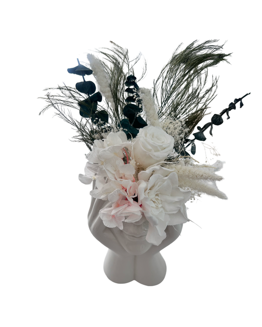 ceramic vase with dry and preserved roses