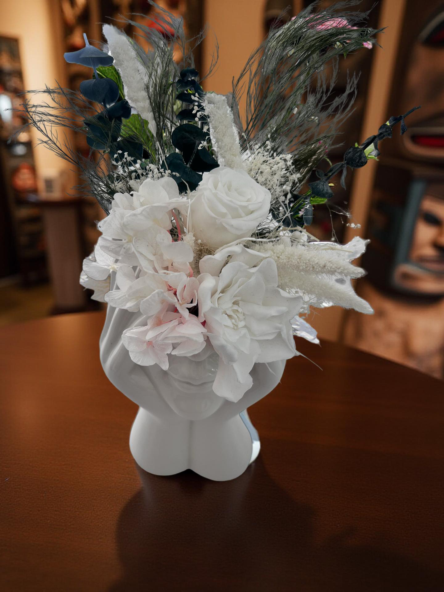 ceramic vase with dry and preserved roses