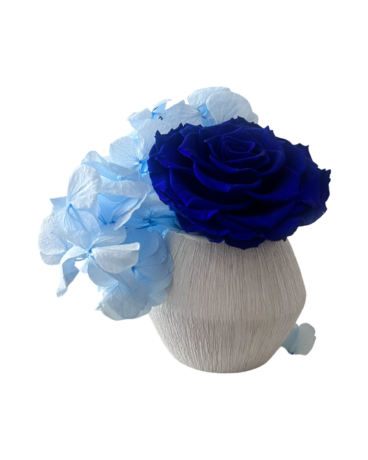 Blue roses with hydrangeas ceramic vase